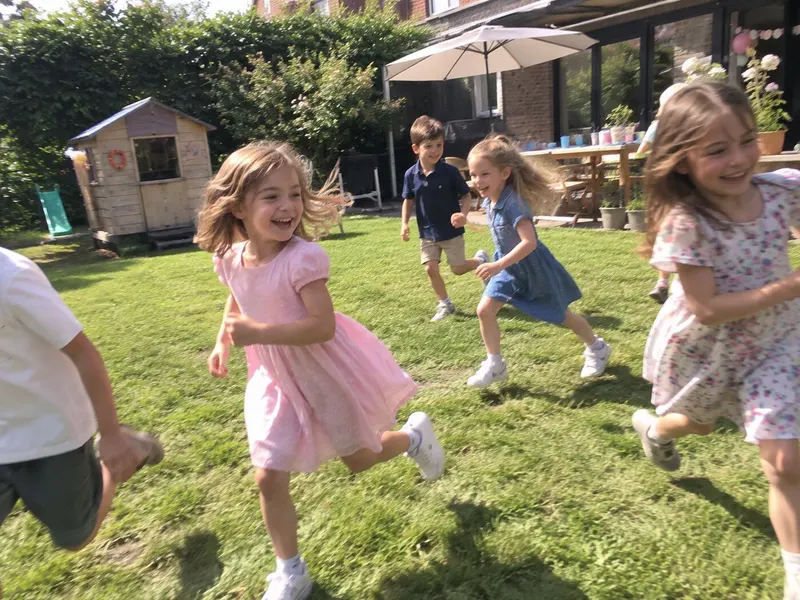 Children race across the garden lawn.