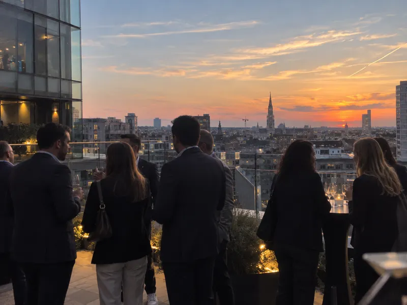 Attendees watch the sunset from the terrace at the end of the day.